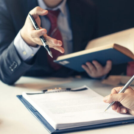 Businessman and lawyer discuss the contract document. Treaty of the law. Sign a contract business. Businessman and lawyer discuss the contract document. Treaty of the law. Sign a contract business.